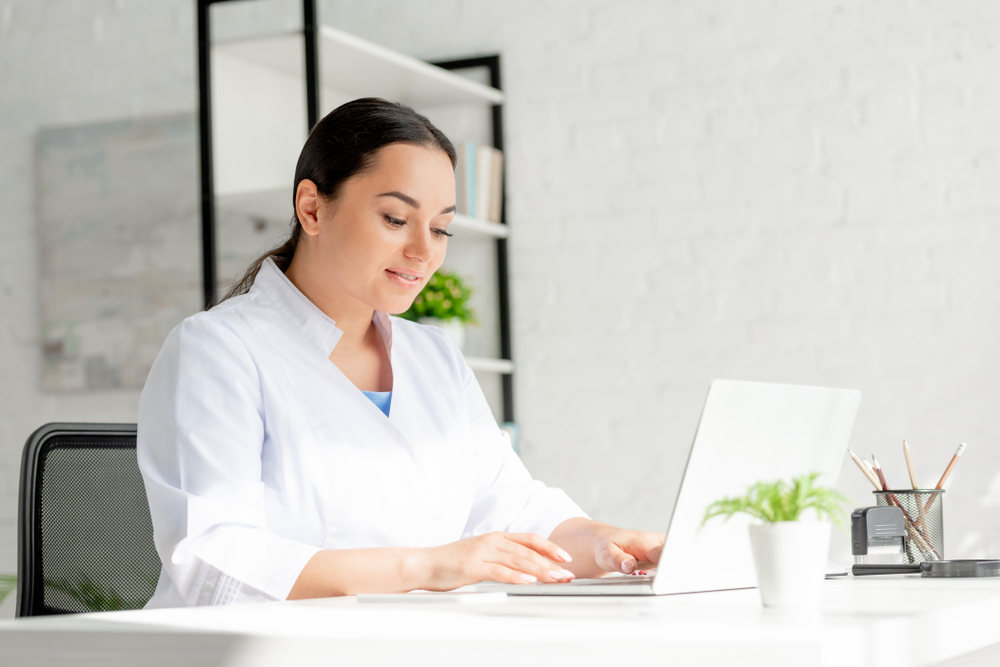 woman accessing Online Dermatology