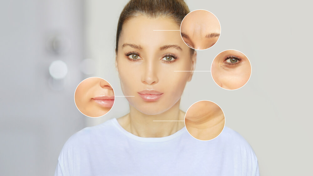 Close-up image of a woman with highlighted facial features, including her lips, eyes, and forehead. The image showcases areas of interest for skincare or cosmetic analysis, emphasizing smooth skin texture and natural beauty. The background is neutral, focusing attention on the woman&apos;s face and the magnified sections that detail specific skin characteristics. This image is ideal for discussions on skincare routines, beauty treatments, or cosmetic products aimed at enhancing facial appearance.