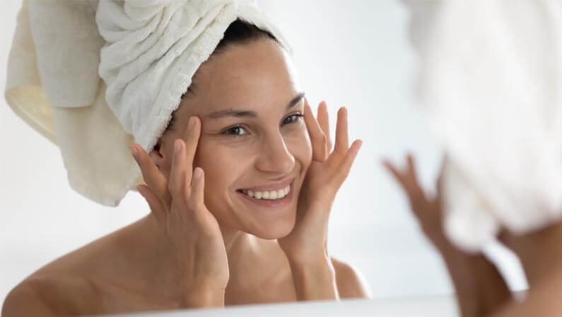 Happy woman for her Skin Tightening results