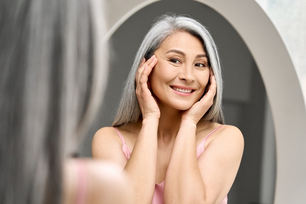 Woman with healthy, vibrant skin after cosmetics treatments in Houston, TX