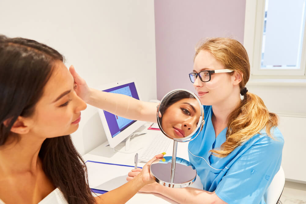 woman in session with a dermatologist