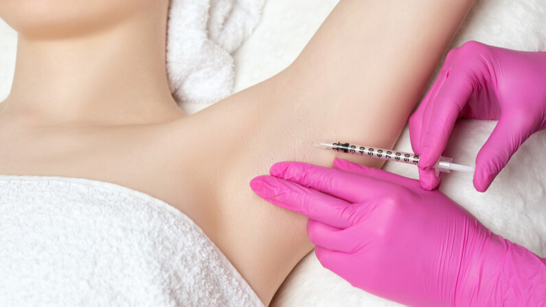 injecting Botox at armpit